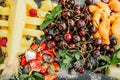 variety tropical fruits tray sliced Ã¢â¬â¹Ã¢â¬â¹pineapple cherries Royalty Free Stock Photo